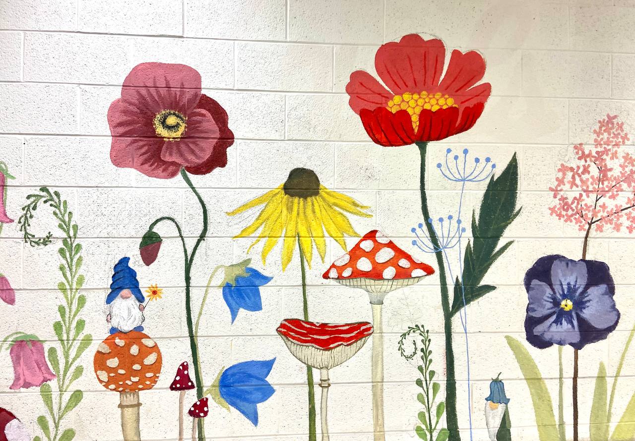 Whimsical garden mural with wildflowers, mushrooms and gnomes